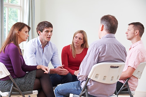 Group of clients discussing their Cigna rehab insurance