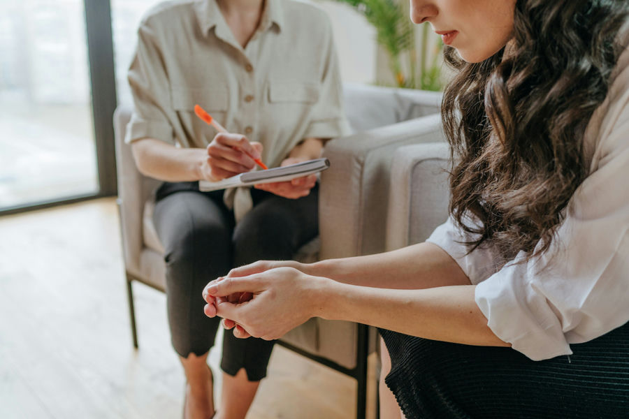 A therapist counseling a client on opioid addiction treatment