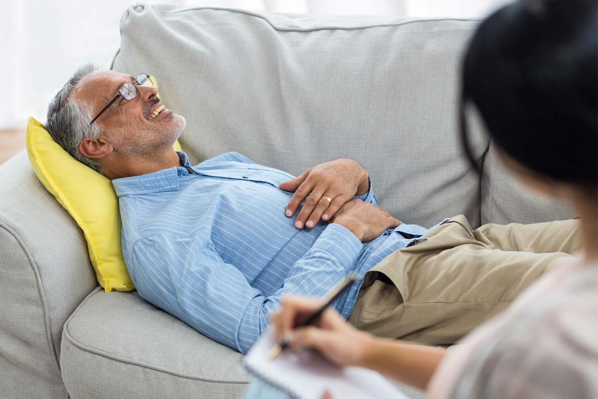 A man enjoys better addiction care during a therapy session
