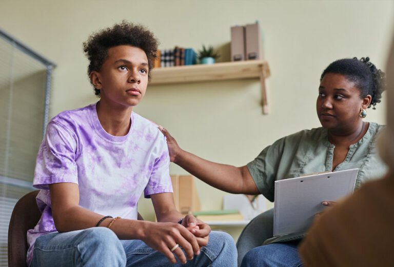 two individuals in a counseling session discussing stimulant abuse