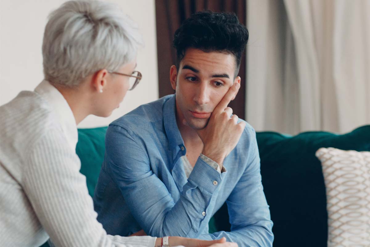 man engaging in rehab counseling