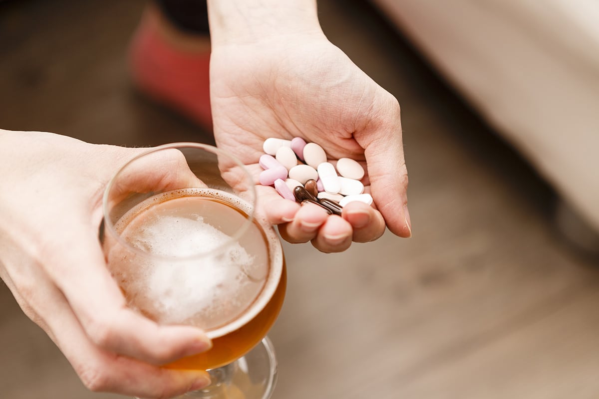 A woman holds xanax and alcohol and wonders about the effects