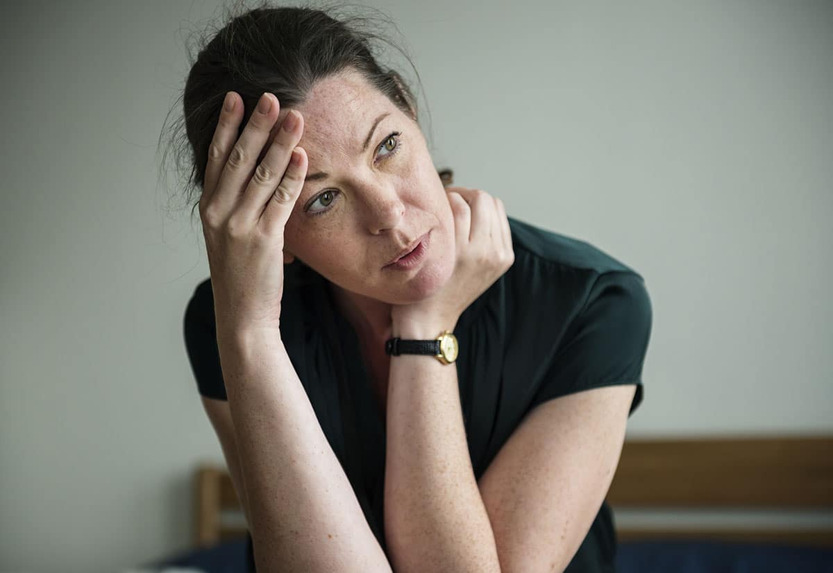 woman looking concerned about cycle of addiction