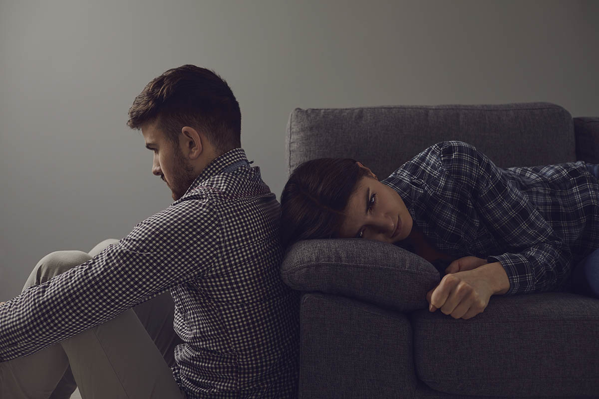 couple not facing each other on couch showing family and overdose risks