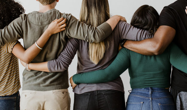 friends holding each other up during suicide prevention week