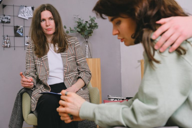 patient showing signs of painkiller addiction receiving counseling from therapist