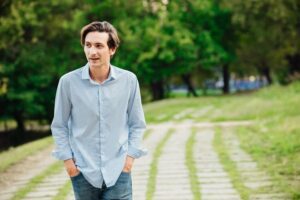 young man walking on a path wondering the different types of relapse triggers