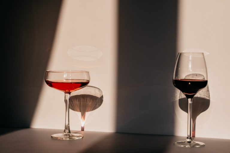 two glasses of alcohol symbolizing how isolation affects alcoholism