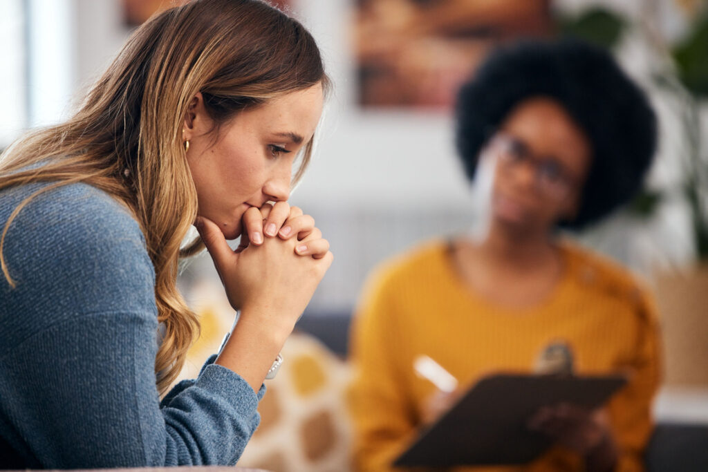 two people in counseling discussing the connection between addiction and suicide