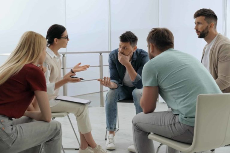 group of people planning a cocaine addiction intervention discussion