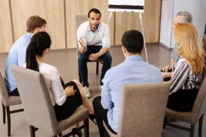 Counselor leading a group therapy program