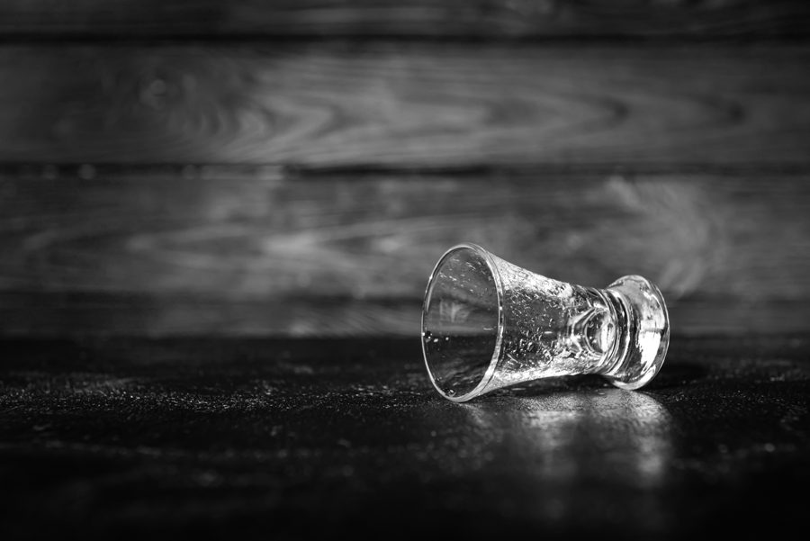 Empty glass on table. Concept of alcoholism