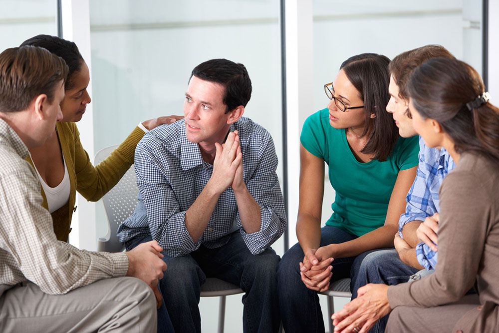A group therapy session discussing overdosing on Suboxone