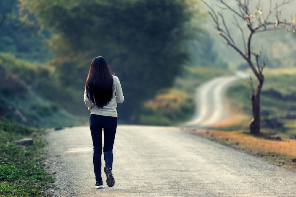 woman walking path