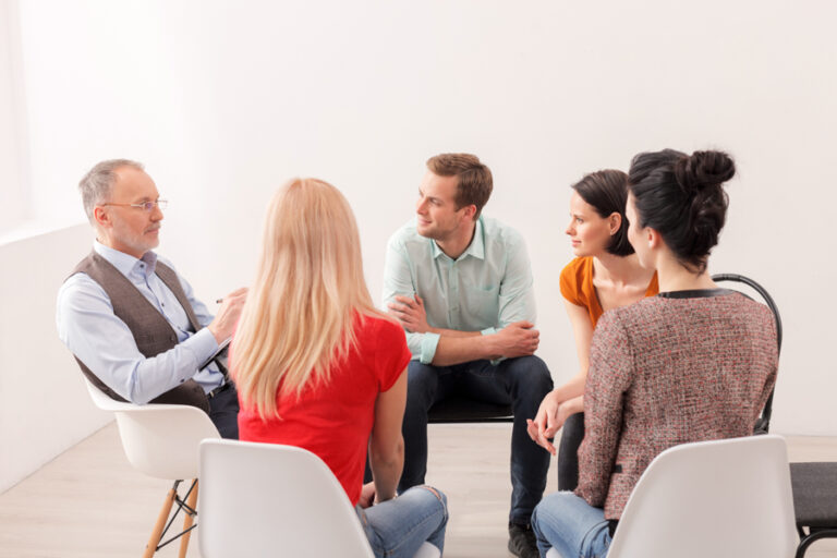 Group of individuals discussing pink cocaine Group of individuals discussing pink cocaine