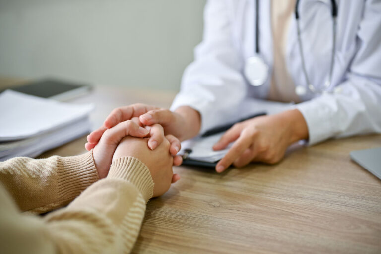 therapist explains the benefits of an iop program to a patient