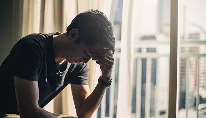 a man experiencing mental health problem