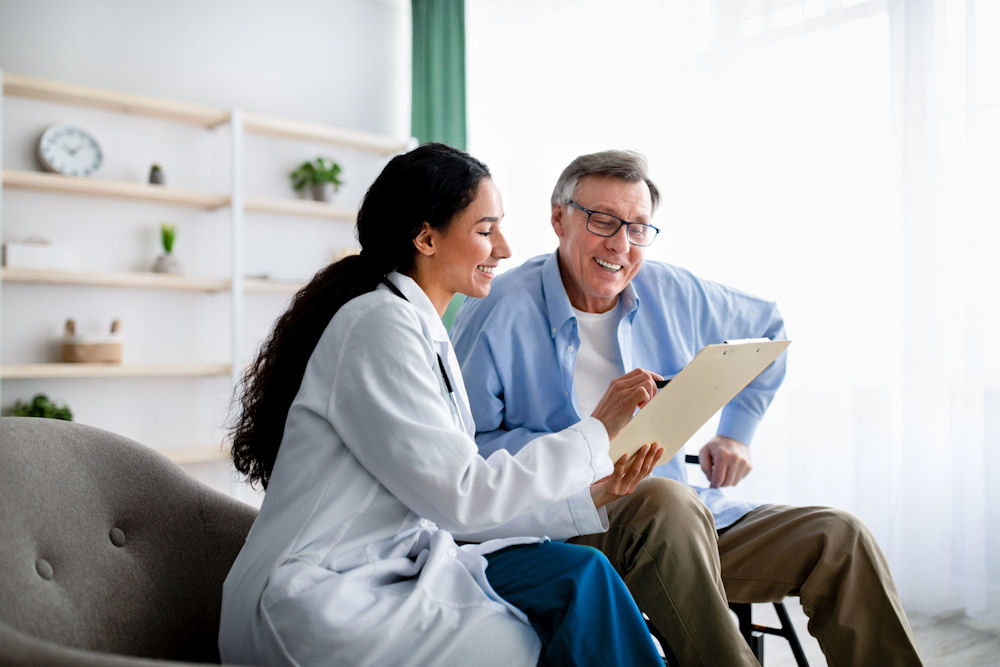 Doctor discussing insurance coverage with her patient Doctor discussing insurance coverage with her patient